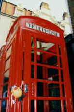 Spud tries to use a phonebox in jolly ole London town