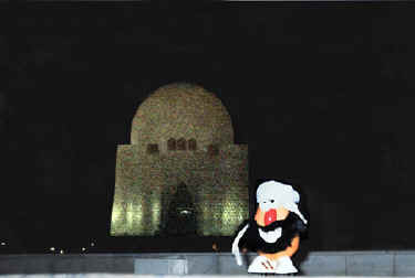 Spud dons a beard and headcovering before entering the sacred Quaid-i-Azam Mausoleum