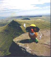 Spud soaks up some rays while admiring the sprawling hills of the Brecon Beacons in Wales