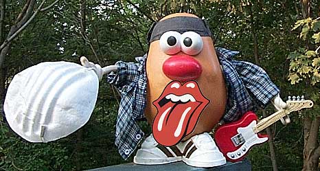 Spud swaps his mask for a guitar to jam with the Stones