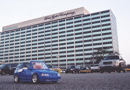 Spud drives his new Mustang Cobra convertible off the lot at Ford Motor Company's World Headquarters