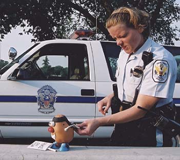 Spud gets the cuffs slapped on