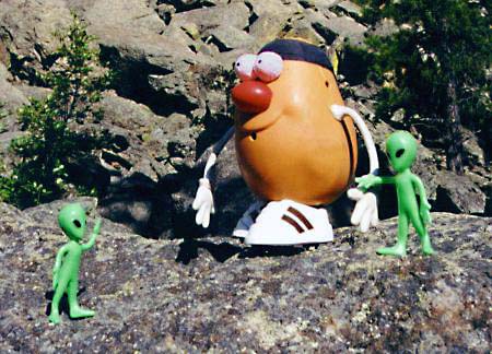 Aliens meet Spud at the foot of the Devil's Tower